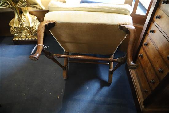 A George II mahogany wing armchair, W.2ft 3in. D.2ft 6in. H.3ft 11in.
